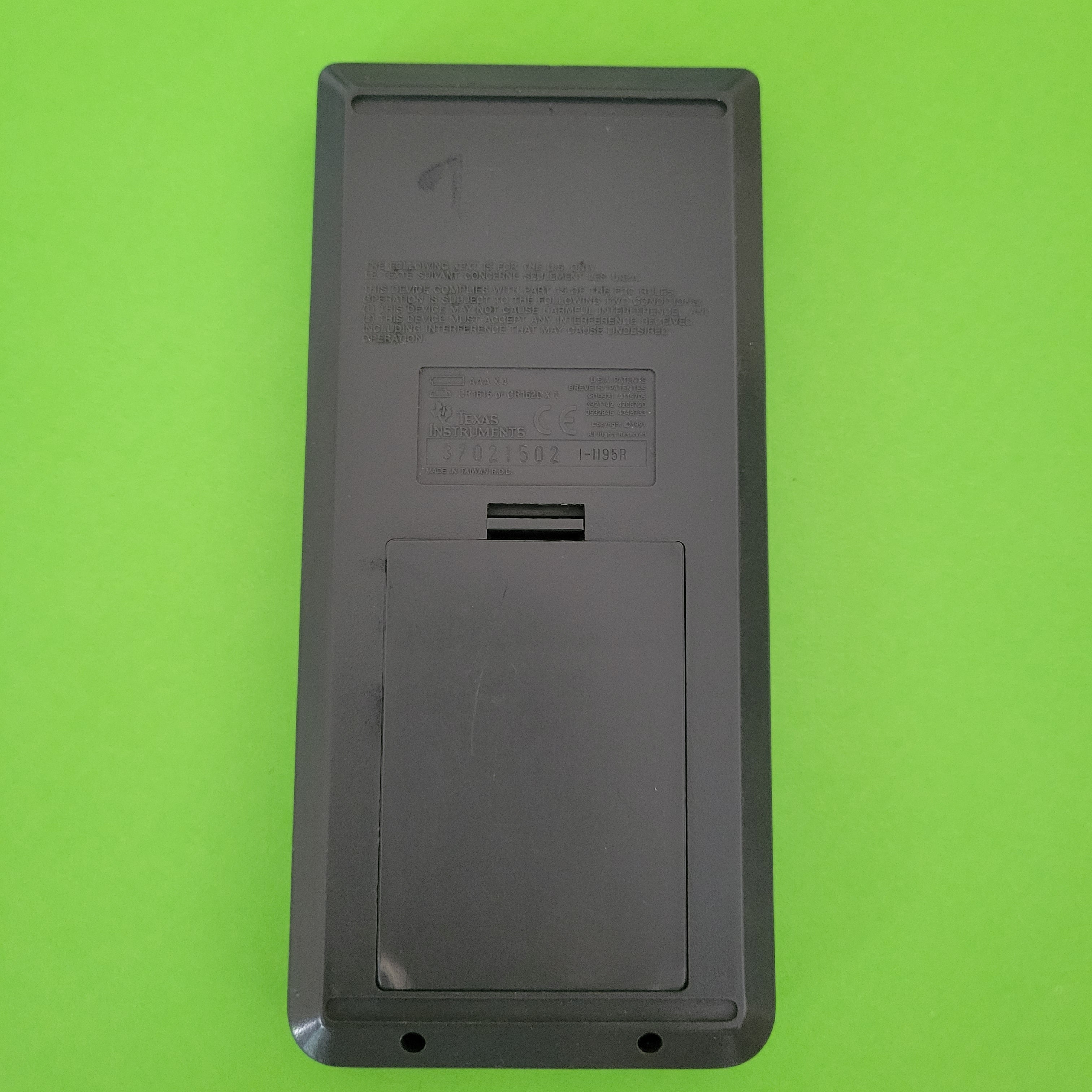An image of the back of a texas instruments ti82 graphing calculator